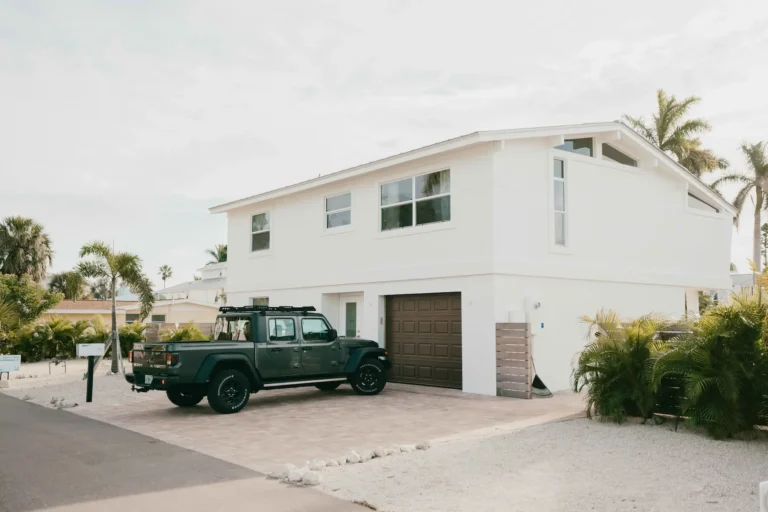 Gulf-coast style home exterior showing paint condition affected by salt air exposure