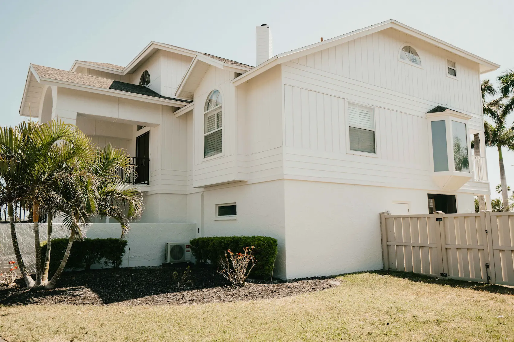 Exterior painting in North Sarasota by Sarasota Painters™ from green to white 12
