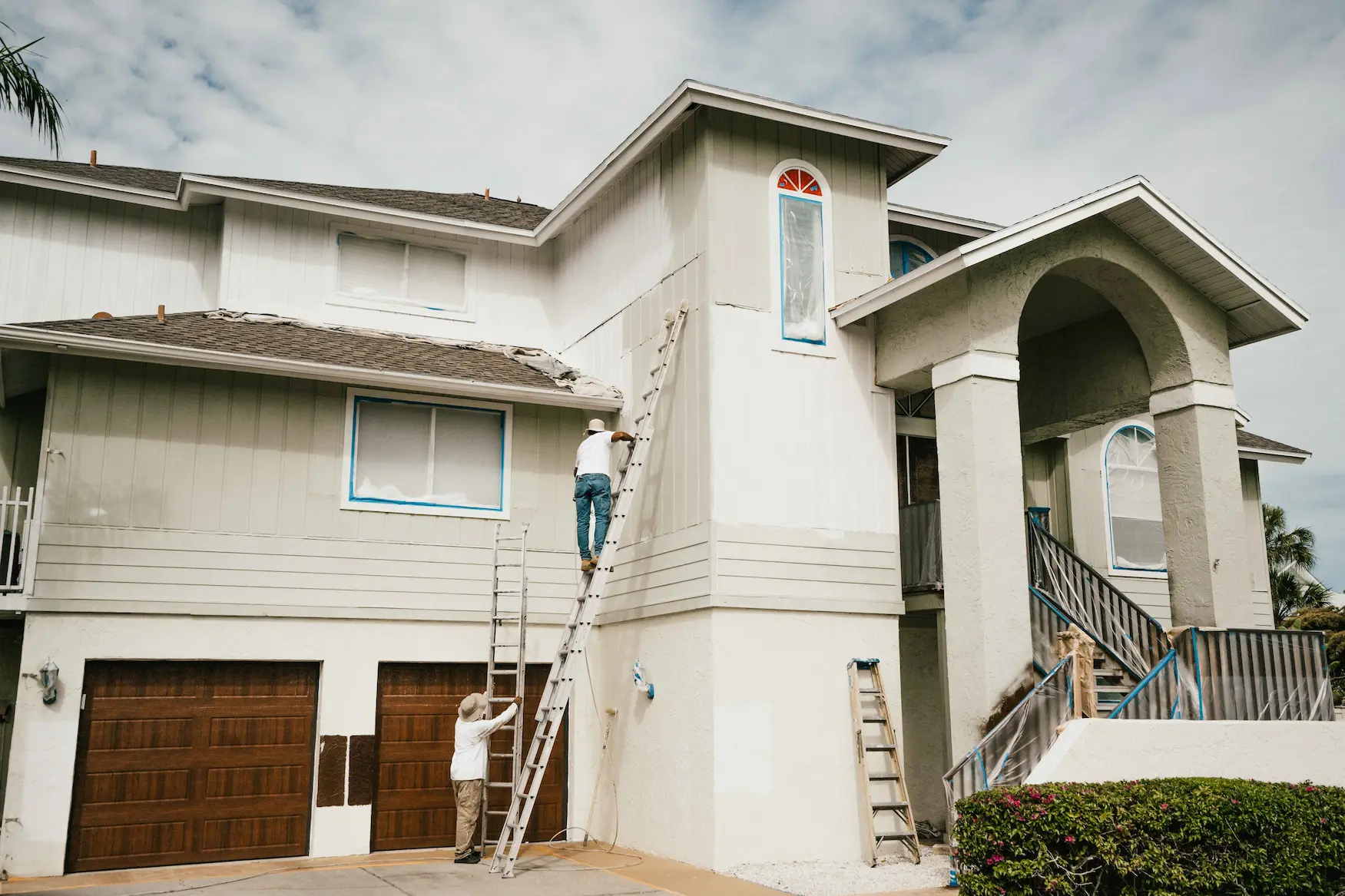 Exterior painting in North Sarasota by Sarasota Painters™ from green to white 16