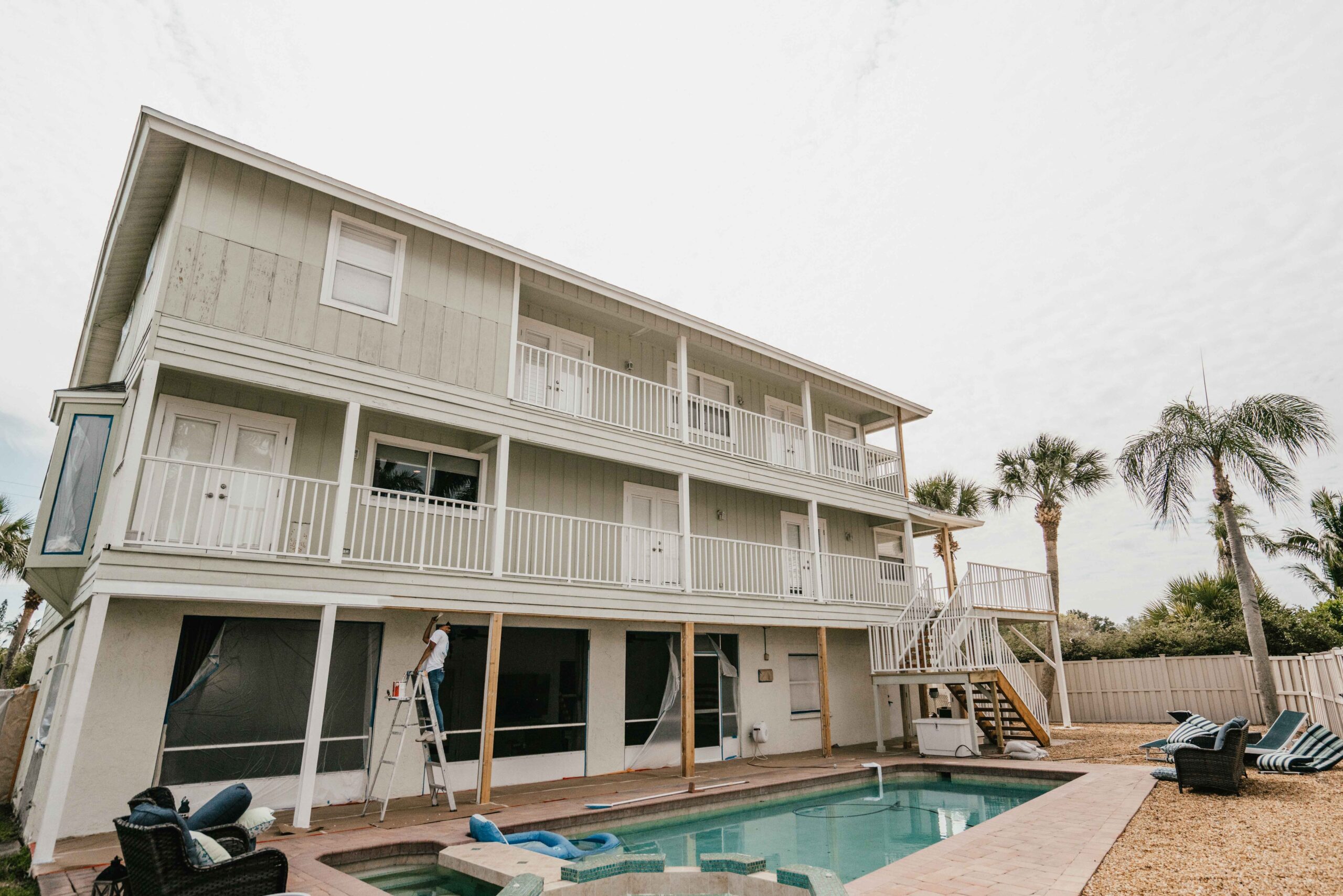 Exterior painting in North Sarasota by Sarasota Painters™ from green to white 8
