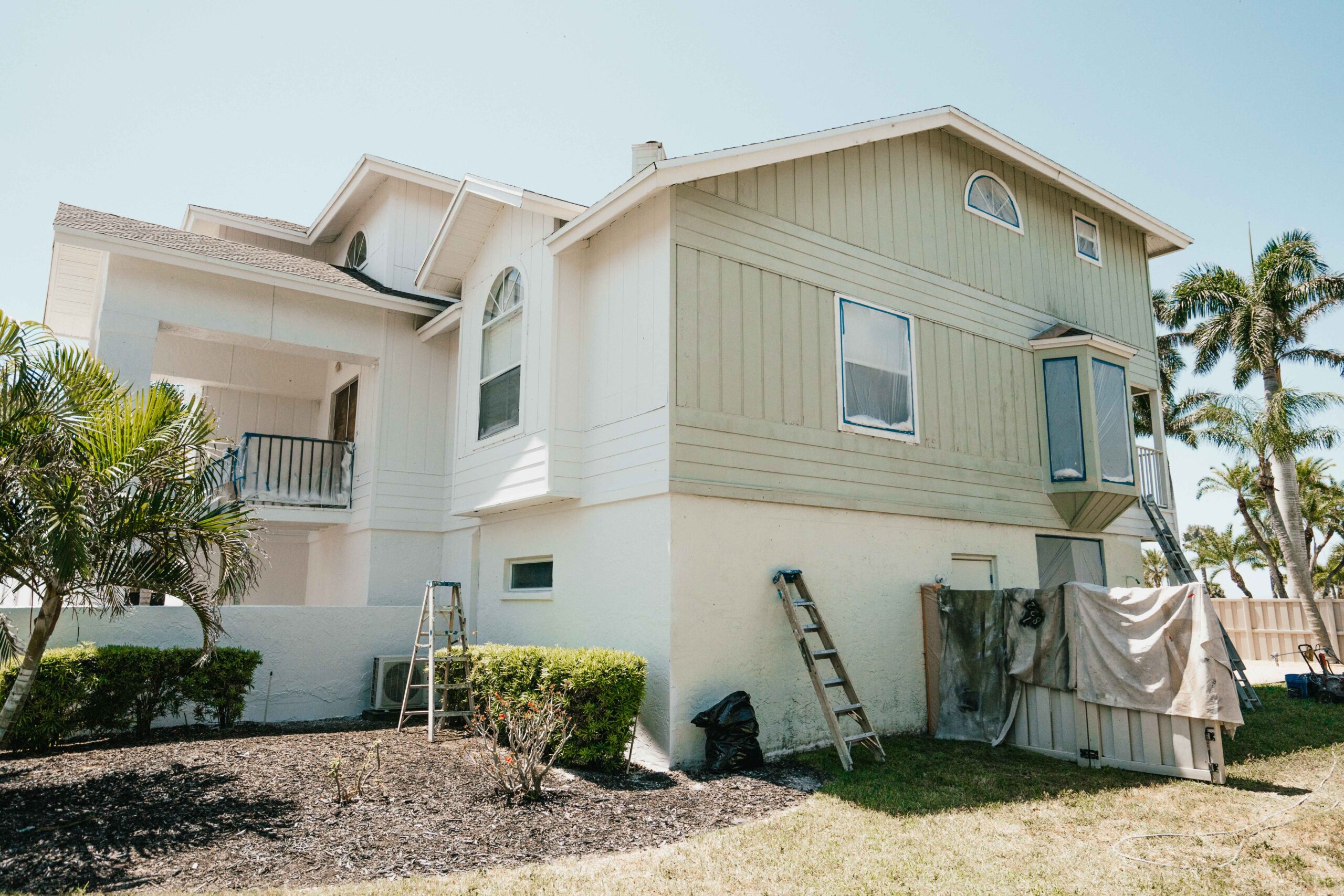 Exterior painting in North Sarasota by Sarasota Painters™ from green to white 9